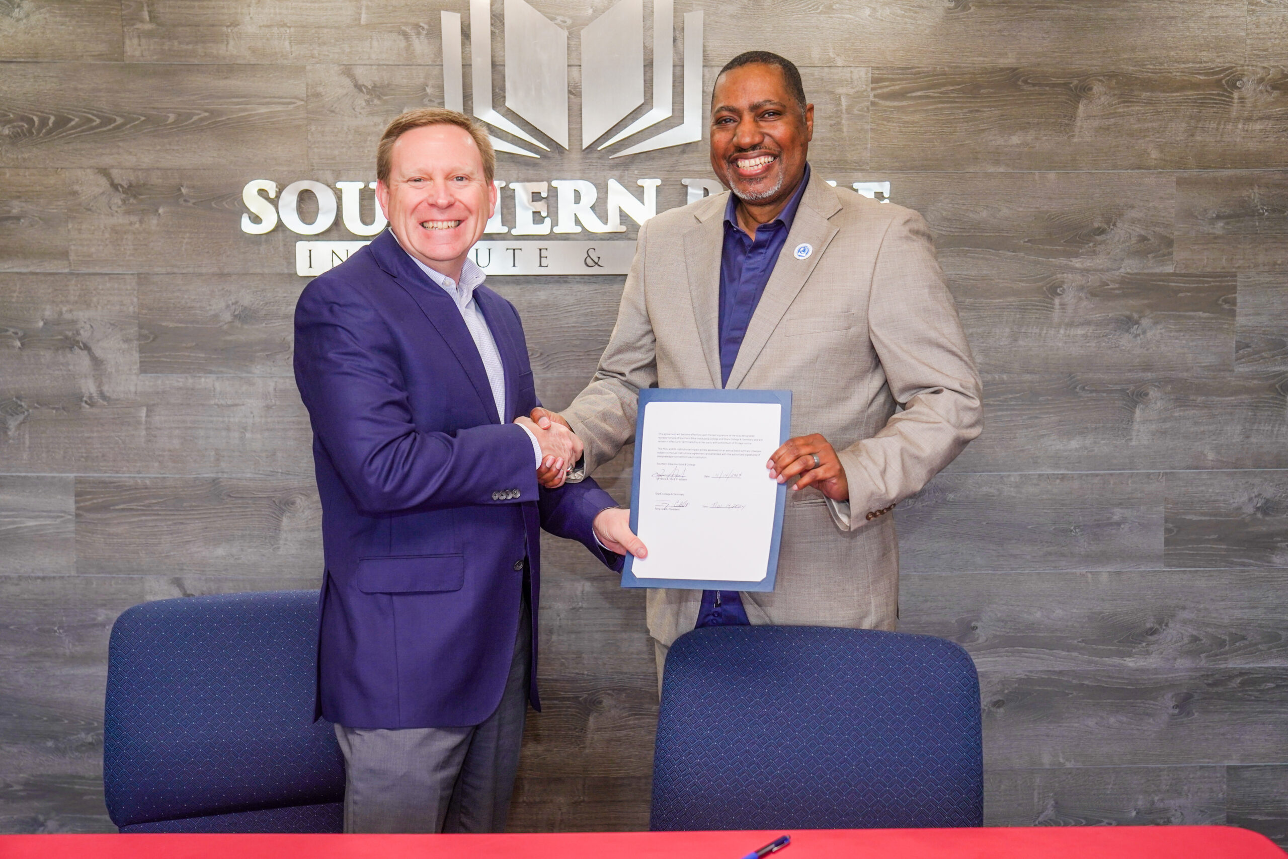 President of Stark, Dr. Tony Celelli, and President of Foster College, Dr. Terrance A. Ford.